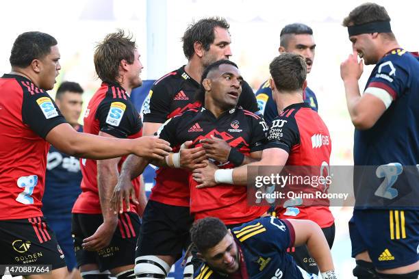 Richie Mo'unga of the Crusaders is congratulated by team mates after scoring a try during the round two Super Rugby Pacific match between Crusaders...