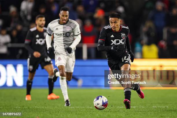 Andy Najar of DC United kicks the ball against Toronto FC during the second half of the MLS game at Audi Field on February 25, 2023 in Washington, DC.
