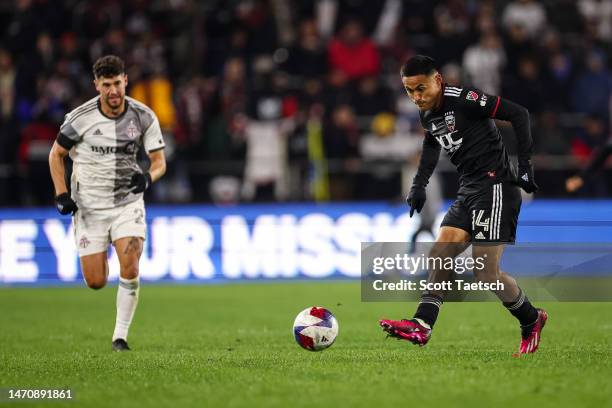 Andy Najar of DC United kicks the ball against Toronto FC during the second half of the MLS game at Audi Field on February 25, 2023 in Washington, DC.