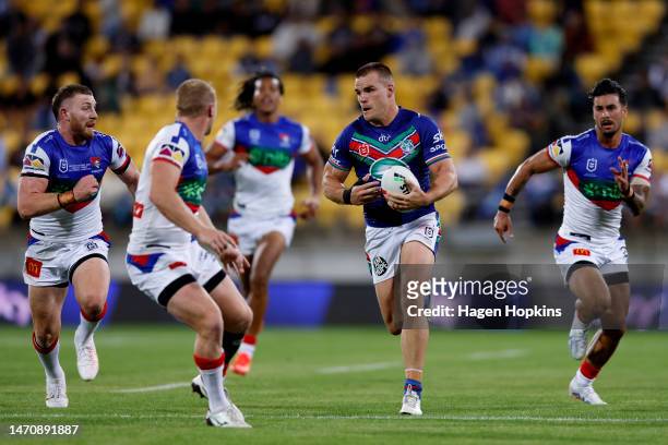 Jackson Ford of the Warriors makes a break during the round one NRL match between the New Zealand Warriors and Newcastle Knights at Sky Stadium on...