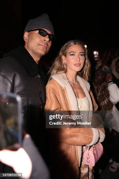 Emili Sindlev wears shearling brown jacket, white body, pants with print, rose bag outside Isabel Marant during Pariser Fashion Week on March 02,...