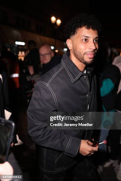 Fashion Week Guest seen wearing a black jacket and pants outside Isabel Marant during Pariser Fashion Week on March 02, 2023 in Paris, France.