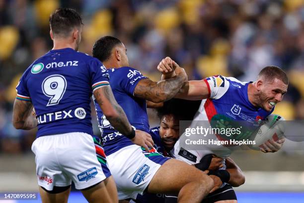 Adam Elliott of the Knights charges forward during the round one NRL match between the New Zealand Warriors and Newcastle Knights at Sky Stadium on...