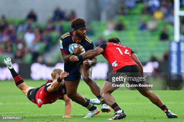 Mosese Dawai of the Highlanders is tackled during the round two Super Rugby Pacific match between Crusaders and Highlanders at AAMI Park, on March 03...