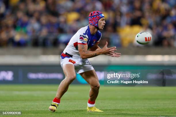 Kalyn Ponga of the Knights receives a pass during the round one NRL match between the New Zealand Warriors and Newcastle Knights at Sky Stadium on...