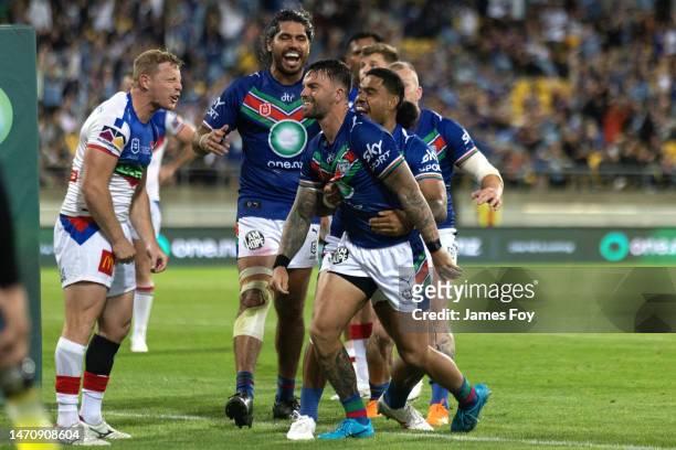 Wayde Egan of the Warriors celebrates after scoring a try during the round one NRL match between the New Zealand Warriors and Newcastle Knights at...