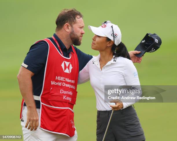 Danielle Kang of The United States embraces her caddie on the eighteenth green after finishing her round during Day Two of the HSBC Women's World...