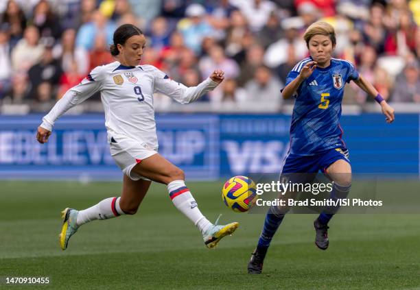 Mallory Swanson of the United States sprints past Shiori Miyake of Japan during the SheBelieves Cup game between Japan and USWNT at Geodis Park on...