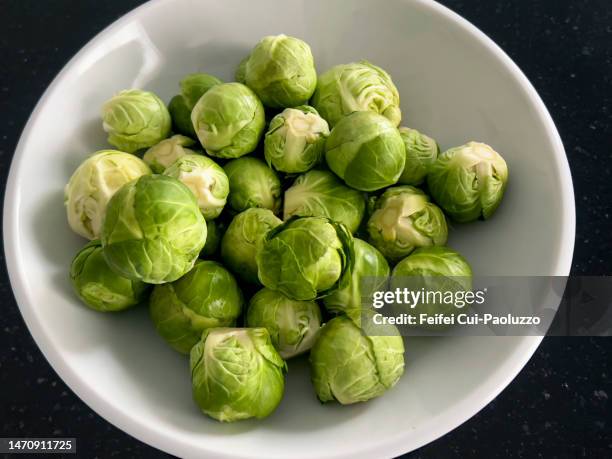 close-up of a bowl of brussels sprout - brussels sprout stock pictures, royalty-free photos & images