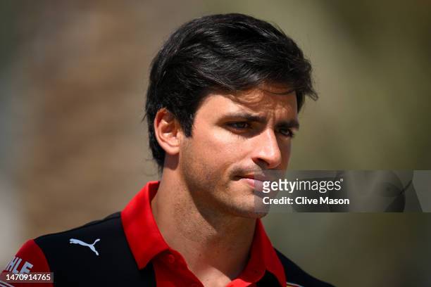 Carlos Sainz of Spain and Ferrari walks in the Paddock prior to practice ahead of the F1 Grand Prix of Bahrain at Bahrain International Circuit on...