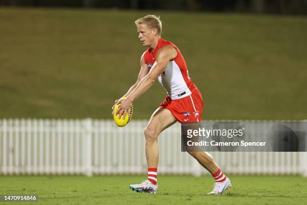 Isaac Heeney of the Swans kicks during the AFL Practice Match between the Sydney Swans and the Carlton Blues at Blacktown International Sportspark on...