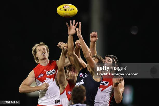 Charlie Curnow of the Blues and Nick Blakey of the Swans contest the ball during the AFL Practice Match between the Sydney Swans and the Carlton...