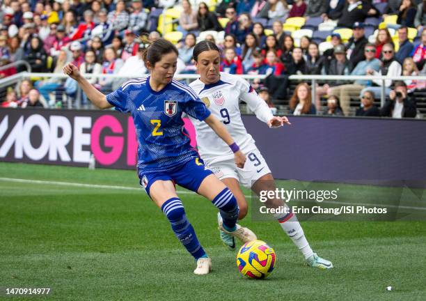 Mallory Swanson of the United States defends Risa Shimizu of Japan during a game between Japan and USWNT at Geodis Park on February 19, 2023 in...