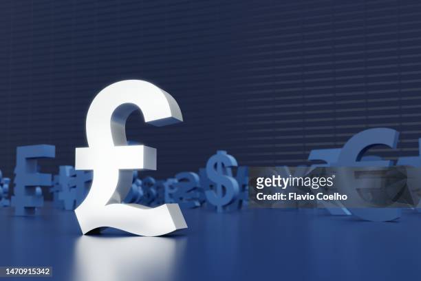 british pound sign standing out from other currencies - libra cryptocurrency fotografías e imágenes de stock