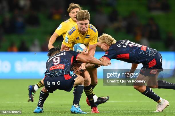 Jordie Barrett of the Hurricanes is tackled during the round two Super Rugby Pacific match between Melbourne Rebels and Hurricanes at AAMI Park, on...