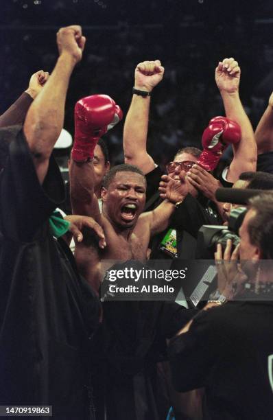 Sugar Shane Mosley from the United States raises his arms in celebration after defeating Oscar De La Hoya during their World Boxing Council and...