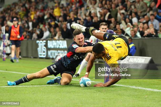 Salesi Rayasi of the Hurricanes scores a try during the round two Super Rugby Pacific match between Melbourne Rebels and Hurricanes at AAMI Park, on...