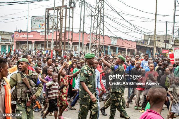 Congolese youths march during the "Ville morte" operation organised by pressure groups and citizen movements in Goma , 6 February 2023. The Congolese...