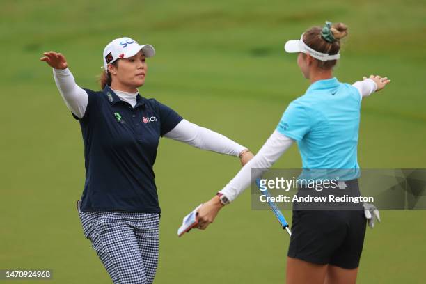 Ariya Jutanugarn of Thailand embraces Nelly Korda of The United States on the eighteenth green during Day Two of the HSBC Women's World Championship...