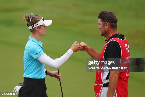 Nelly Korda of The United States fist bumps her caddie on the eighteenth green during Day Two of the HSBC Women's World Championship at Sentosa Golf...