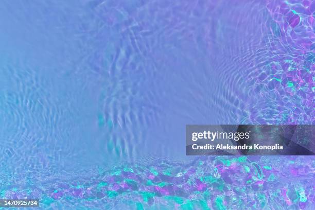 ethereal bright holographic blue, purple,  pink, turquoise, mint green transparent water surface texture with ripples, splashes, waves - nightclub bathroom stock pictures, royalty-free photos & images