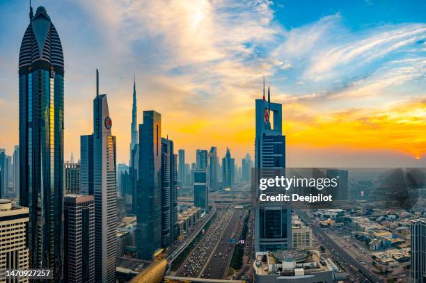 futuristic downtown dubai city skyline at sunset, united arab emirates - arial view dubai skyline stock pictures, royalty-free photos & images