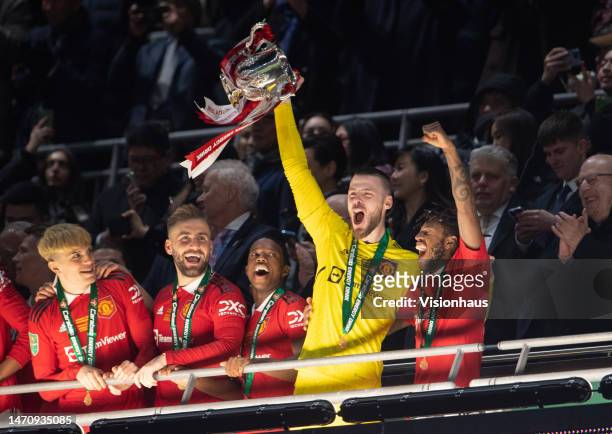 Manchester United players Alejandro Garnacho, Luke Shaw, Tyrell Malacia, David de Gea and Fred celebrate with the trophy after the Carabao Cup Final...