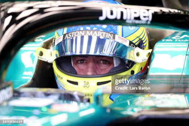 Fernando Alonso of Spain and Aston Martin F1 Team prepares to drive in the garage during practice ahead of the F1 Grand Prix of Bahrain at Bahrain...