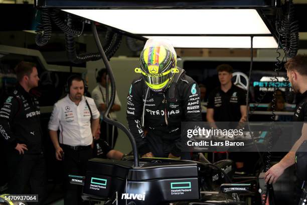 Lewis Hamilton of Great Britain and Mercedes prepares to drive in the garage during practice ahead of the F1 Grand Prix of Bahrain at Bahrain...