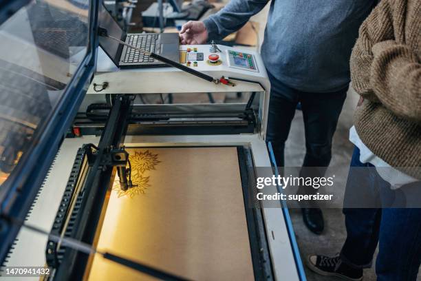 close up of laser cut machine - laser engraving stock pictures, royalty-free photos & images