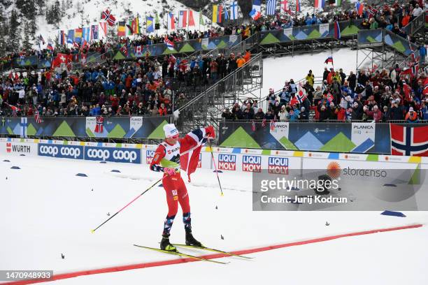 Johannes Hoesflot Klaebo of Team Norway crosses the finish line for Norway to win the Cross-Country Men's 4x10km Relay Classic/Free at the FIS Nordic...