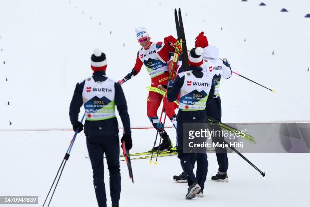 Johannes Hoesflot Klaebo of Team Norway celebrates with teammates at the finish area after winning the Cross-Country Men's 4x10km Relay Classic/Free...