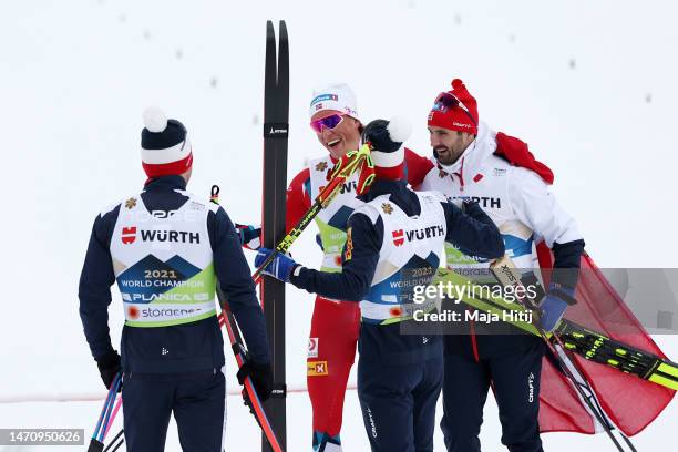 Johannes Hoesflot Klaebo of Team Norway celebrates with teammates at the finish area after winning the Cross-Country Men's 4x10km Relay Classic/Free...