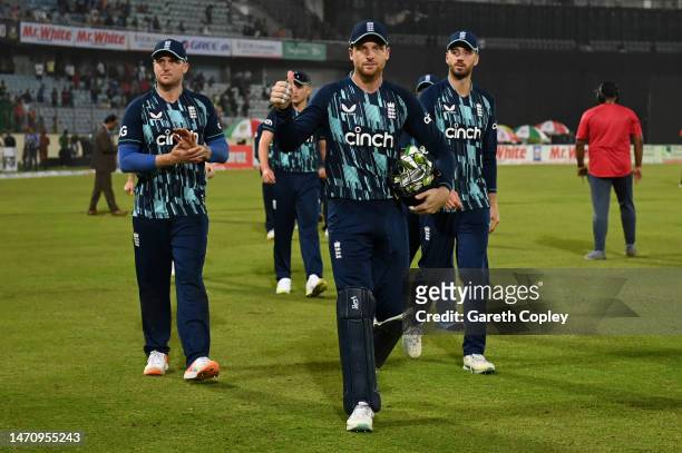 England captain Jos Buttler leads off his team after winning the 2nd One Day International between Bangladesh and England at Sher-e-Bangla National...