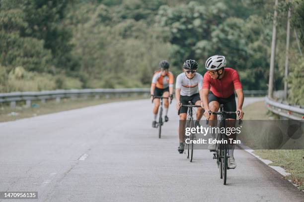 asian chinese cyclist enjoying morning rural scene - race leader athlete stock pictures, royalty-free photos & images