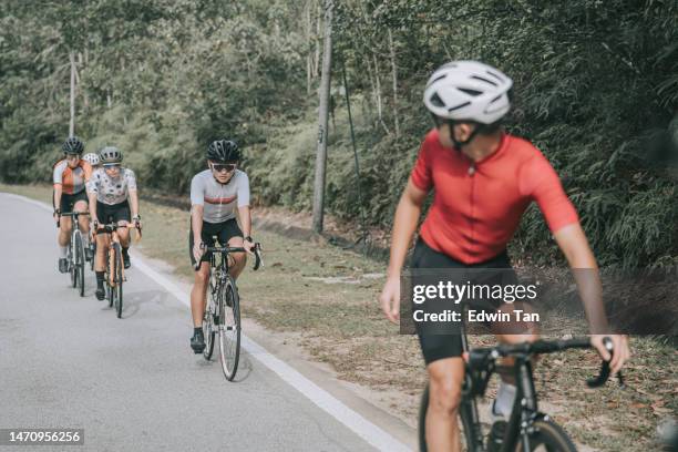 asian chinese cyclist leader leading team practice cycling in rural - race leader athlete stock pictures, royalty-free photos & images