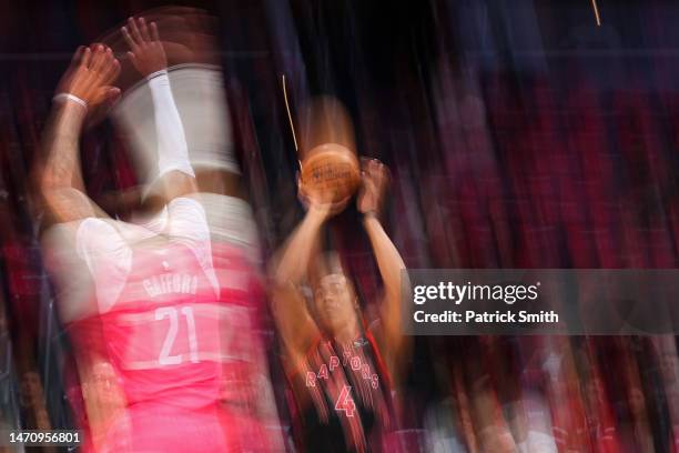 Scottie Barnes of the Toronto Raptors shoots in front of Daniel Gafford of the Washington Wizards during the first half at Capital One Arena on March...