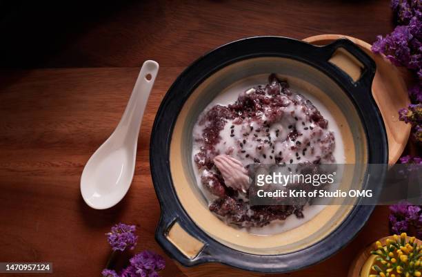 black sticky rice pudding in coconut milk - black rice stock pictures, royalty-free photos & images