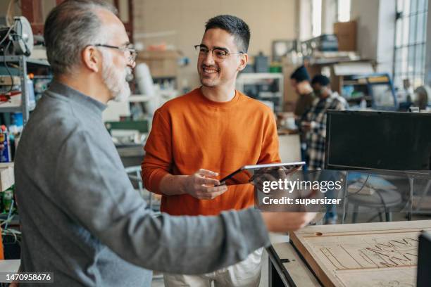 working together - laser engraving stock pictures, royalty-free photos & images
