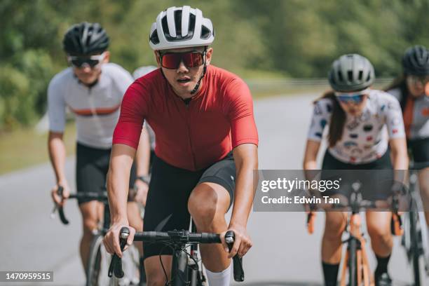 group of asian chinese cyclist competing in cycling event at rural scene in the morning - cycling team stock pictures, royalty-free photos & images