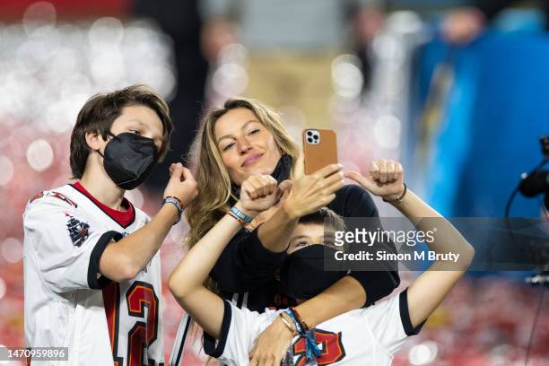 Gisele Bundchen wife of Tom Brady quarterback for the Tampa Bay Buccaneers takes a selfie with Benjamin Brady and John Moynahan after the finish of...