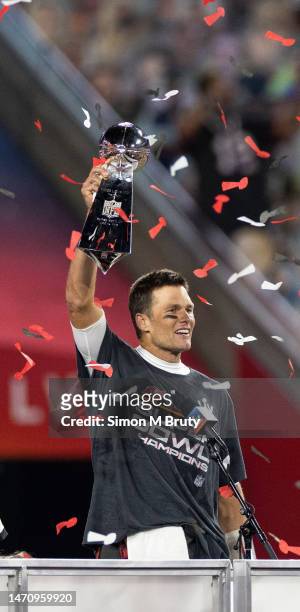 Tom Brady raises the Lombardi Trophy during the award ceremony for Super Bowl LV at Raymond James Stadium on February 07, 2021 in Tampa, Florida. The...
