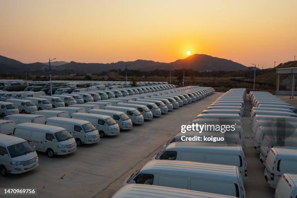 electric minivan at sunset - bus side view stock pictures, royalty-free photos & images