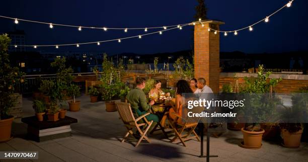 friends having dinner - terraced field stockfoto's en -beelden