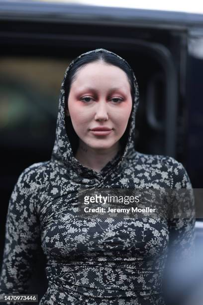 Noah Cyrus seen wearing a grey, black and white dress, tights and black boots outside Off-White show, during Pariser Fashion Week, on March 02, 2023...