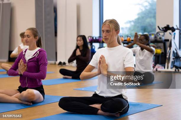 yoga breath work - teenager yoga stock pictures, royalty-free photos & images