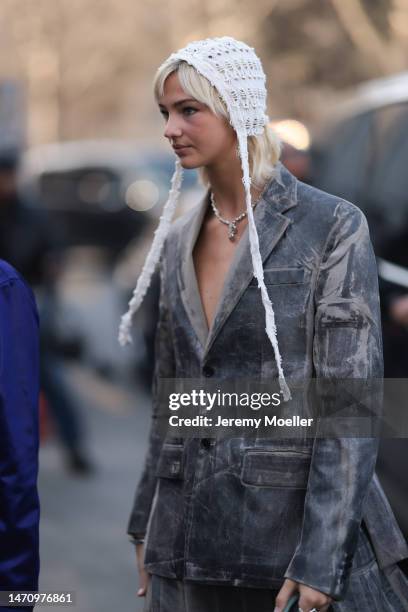 Mia Regan seen wearing a white balaklava, a grey jacket and a silver necklace outside Off-White show during Pariser Fashion Week on March 02, 2023 in...