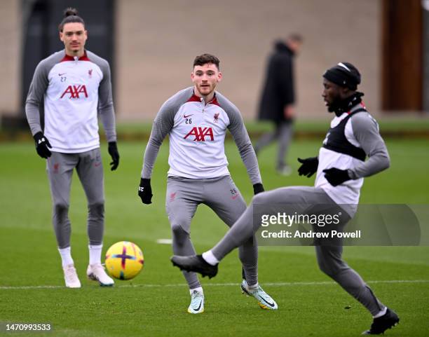 Andy Robertson and Naby Keita of Liverpool during a training session at AXA Training Centre on March 03, 2023 in Kirkby, England.
