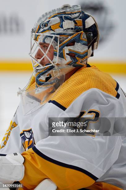 Goalternder Kevin Lankinen of the Nashville Predators stretches on the ice during warm ups prior to the start of the game against the Florida Panther...