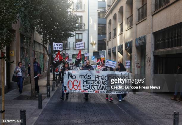 Workers of the Summa 112 emergency call center, which answers 061, protest during a march from Puerta Del Sol to the Consejeria de Sanidad, on March...